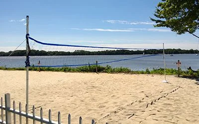 Waterside sand volleyball court with net
